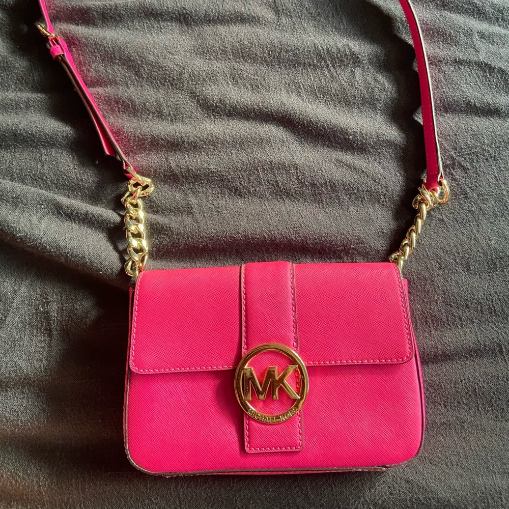 MK cross body hot pink purse.